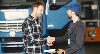 two-guys-talking-about-work-work-garage-near-truck-transfer-documents-with-goods